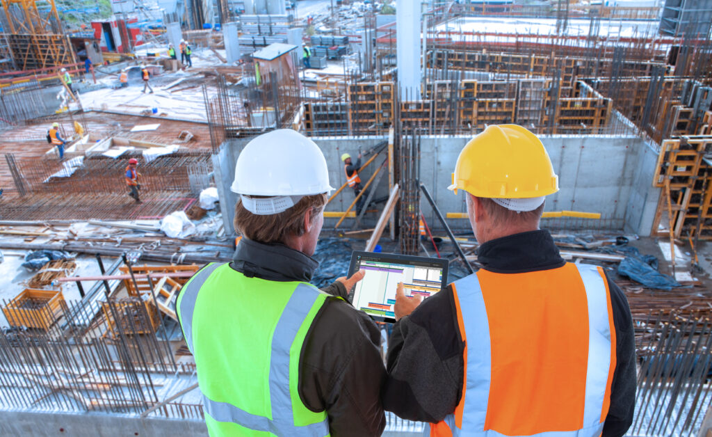 construction workers at building site using Touchplan